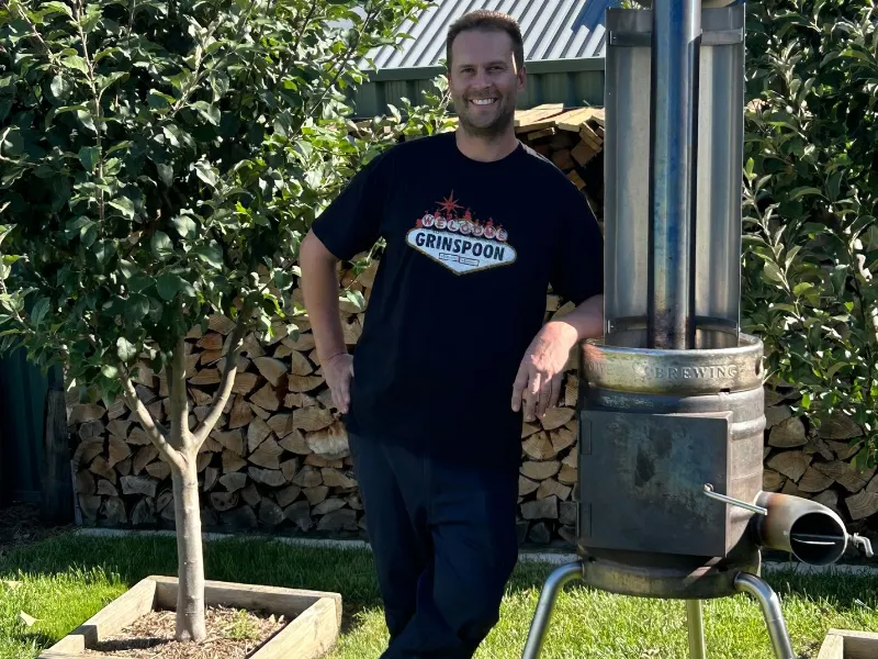 man beside Rocketship Outdoor Heater